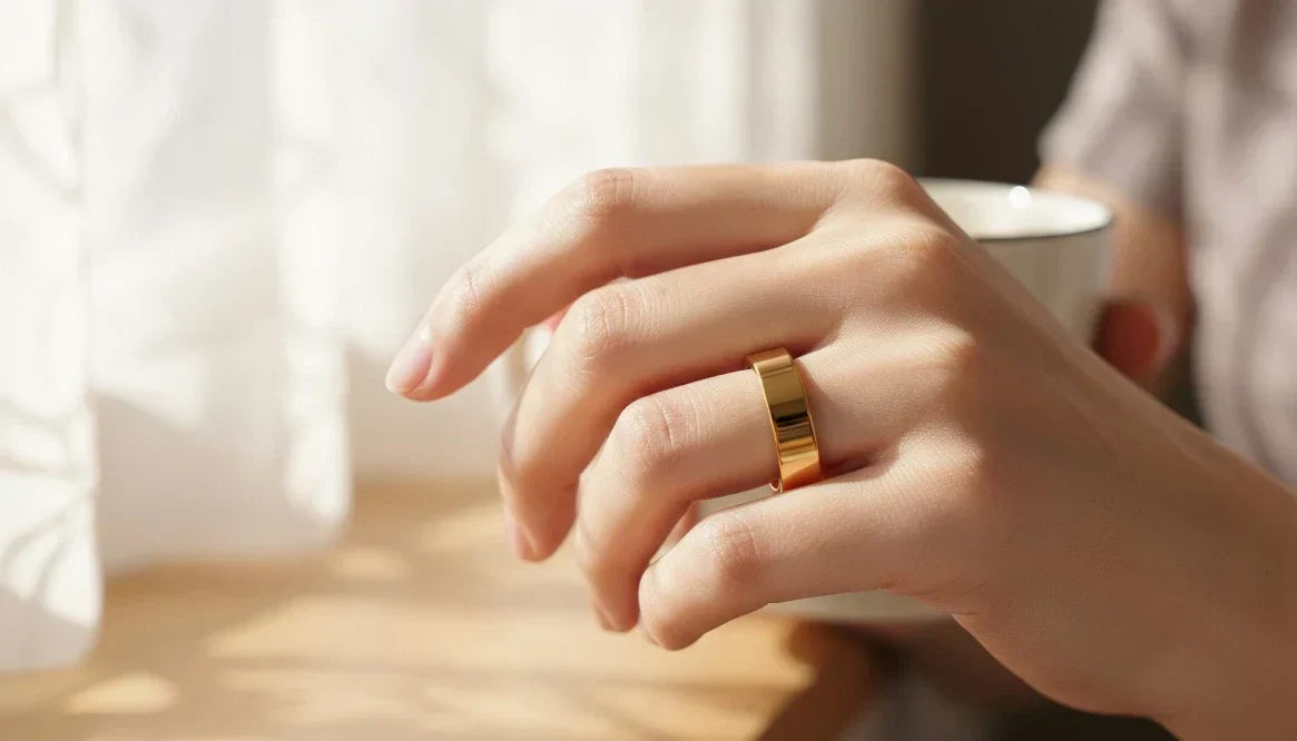 Hand wearing a gold Omlezo Magnetic Copper Ring