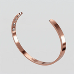 Animated view of the rose gold Omlezo Magnetic Copper Bracelet with visible magnetic energy waves
