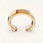Close-up of the gold Omlezo Copper Magnetic Ring in a product display