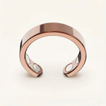 Close-up of the rose gold Omlezo Copper Magnetic Ring in a product display