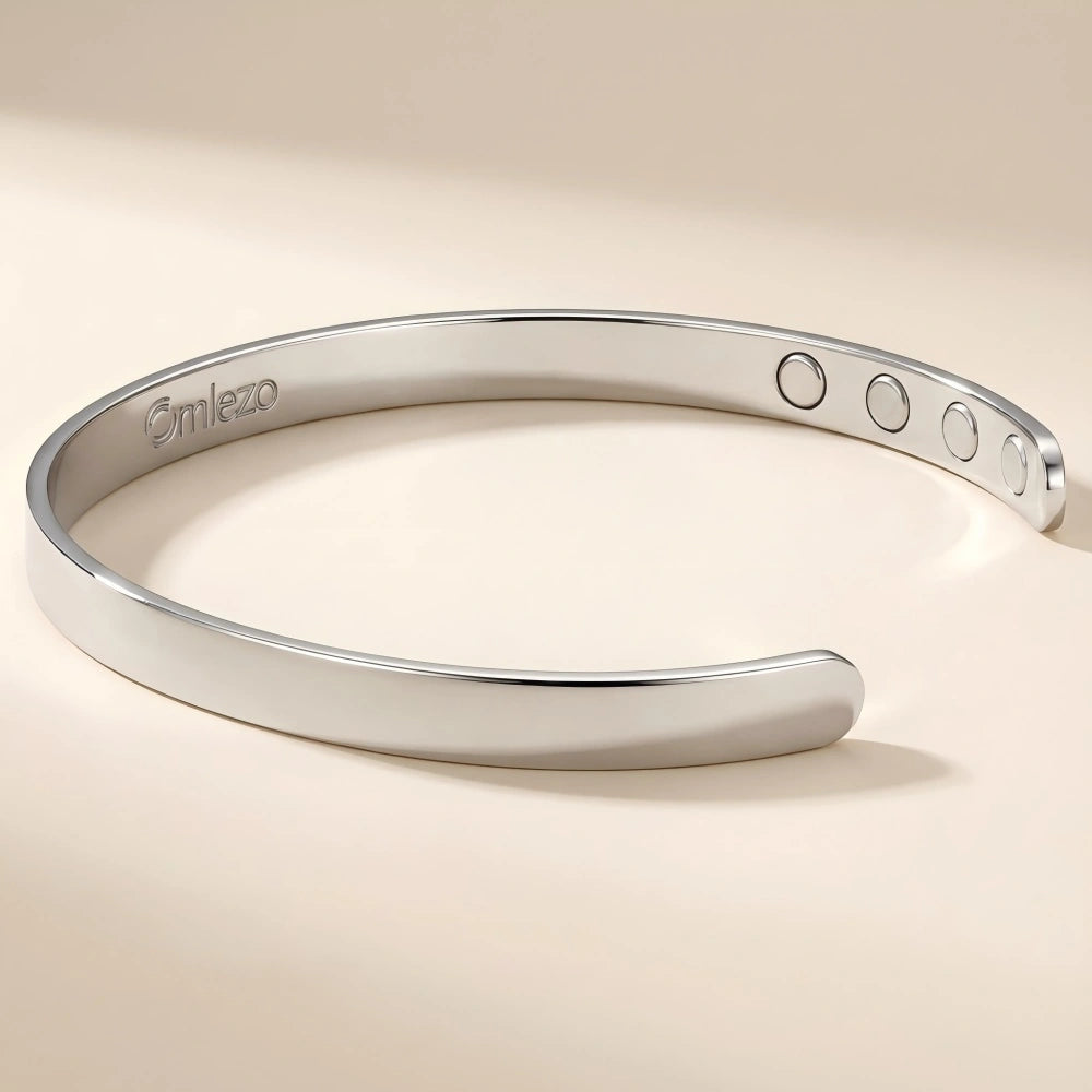 The Omlezo silver magnetic copper bracelet is placed against a neutral background.